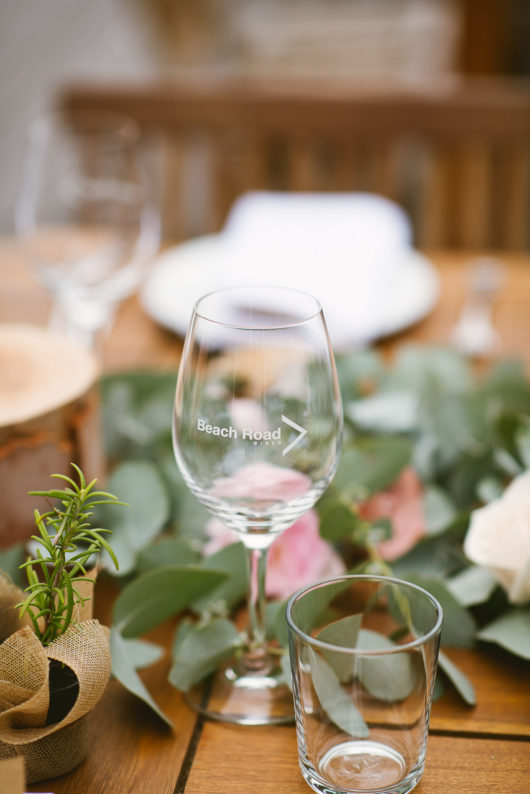 beach road wines glass on table at wedding reception